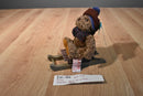 Russ Sleds Brown Teddy Bear Plush on a Wooden Sled