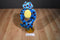 A Hugging Blue and Red Spotted Frog Plush
