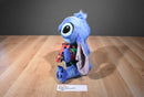 Disney Store Holiday Stitch Plush Wearing a Green Jacket/ Red Scarf