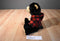 Black Bear Beanbag Plush Wearing a Red Plaid Hoodie