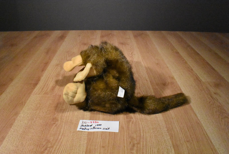 Plushland Brown and Beige Monkey 1999 Plush with a Yellow Banana