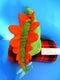 Manhattan Toy Green and Orange Stegosaurus Plush